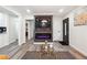 Living area featuring fireplace, built-in TV, and hardwood floors at 2082 Perkerson Sw Rd, Atlanta, GA 30310