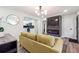 Open concept living room features a mustard sofa and built-in fireplace at 2082 Perkerson Sw Rd, Atlanta, GA 30310