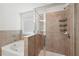 A primary bathroom features a separate tub and shower and a tiled design at 5534 Radford Loop, Fairburn, GA 30213