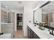 Bathroom features double vanity, walk-in shower, and large soaking tub at 5534 Radford Loop, Fairburn, GA 30213