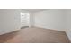 Bonus room with carpeted floor and access to a hallway at 5534 Radford Loop, Fairburn, GA 30213