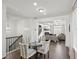Cozy dining area with a glass table, chairs, and seamless flow into the living room at 5534 Radford Loop, Fairburn, GA 30213