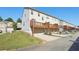 Exterior view of townhomes showcases private garages and deck areas at 5534 Radford Loop, Fairburn, GA 30213