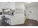 Open-concept kitchen with stainless steel appliances, granite countertops, and a breakfast bar area at 5534 Radford Loop, Fairburn, GA 30213