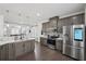 Open concept kitchen with stainless steel appliances and island at 5534 Radford Loop, Fairburn, GA 30213