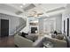 Bright living room with fireplace, neutral palette, coffered ceiling, and seamless indoor-outdoor flow at 5534 Radford Loop, Fairburn, GA 30213