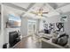 Cozy living room with fireplace, coffered ceiling, and stylish decor, perfect for relaxation at 5534 Radford Loop, Fairburn, GA 30213