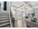 Stylish living room featuring coffered ceilings, a fireplace, and a seamless flow to the outdoor patio at 5534 Radford Loop, Fairburn, GA 30213