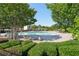 Community pool with lounge chairs and umbrellas at 5534 Radford Loop, Fairburn, GA 30213