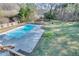 Aerial view of house and expansive backyard pool at 1890 Tribble Ridge Dr, Lawrenceville, GA 30045