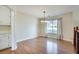 Bright dining area with hardwood floors and a large window overlooking the backyard at 1890 Tribble Ridge Dr, Lawrenceville, GA 30045