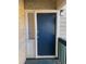 Condo entrance with blue door and small window at 3575 Oakvale Rd # 303, Decatur, GA 30034