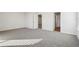 Large bedroom featuring neutral carpeting and multiple entry points at 4182 Waratah Way, Mableton, GA 30126