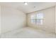 Bright bedroom with neutral walls and carpet at 5016 Whiteoak Se Pointe, Smyrna, GA 30080