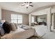 Expansive bedroom with vaulted ceiling, decorative columns, and a cozy sitting area at 5016 Whiteoak Se Pointe, Smyrna, GA 30080