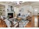 Living room features hardwood floors, a fireplace, and a ceiling fan at 5016 Whiteoak Se Pointe, Smyrna, GA 30080