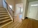 Elegant staircase leading upstairs from the foyer at 730 Lanarck Way, Peachtree City, GA 30269