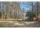 Spacious backyard with mature trees and storage shed at 8298 Holly Dr, Jonesboro, GA 30238