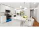 Kitchen island with white quartz countertop and seating for two at 8298 Holly Dr, Jonesboro, GA 30238