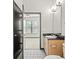 Clean bathroom with wood vanity and view of bedroom at 5300 Peachtree Rd # 3510, Chamblee, GA 30341