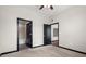 Spacious bedroom with carpet, ceiling fan, and access to bathroom at 5300 Peachtree Rd # 3510, Chamblee, GA 30341