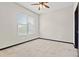 Cozy carpeted bedroom with ceiling fan and large window at 5300 Peachtree Rd # 3510, Chamblee, GA 30341