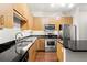Modern kitchen with stainless steel appliances and hardwood floors at 5300 Peachtree Rd # 3510, Chamblee, GA 30341