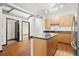 Open concept kitchen with island and hardwood floors at 5300 Peachtree Rd # 3510, Chamblee, GA 30341