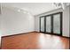 Bright living room with hardwood floors and access to balcony at 5300 Peachtree Rd # 3510, Chamblee, GA 30341