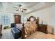 Main bedroom with a king-size bed and tray ceiling at 851 Louisa Ln, Lithonia, GA 30058