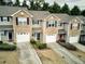 Stone-front townhouses with attached garages at 103 Linton Dr # 1, Acworth, GA 30102