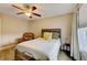 Cozy bedroom with ceiling fan and built-in shelving at 103 Linton Dr # 1, Acworth, GA 30102