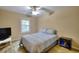 Bright bedroom with wood floors, a ceiling fan, and a window at 103 Linton Dr # 1, Acworth, GA 30102