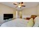Main bedroom with ceiling fan and large TV at 103 Linton Dr # 1, Acworth, GA 30102