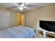 Bedroom with large TV and ceiling fan at 103 Linton Dr # 1, Acworth, GA 30102