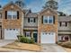 Two-story townhome with stone accents and two-car garage at 103 Linton Dr # 1, Acworth, GA 30102
