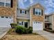 Two-story townhouse with stone accents and garage at 103 Linton Dr # 1, Acworth, GA 30102