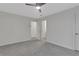 Well-lit bedroom with gray carpeting and multiple access points at 1412 Tuxworth Cir, Decatur, GA 30033