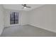 Bright bedroom featuring gray carpeting and ceiling fan at 1412 Tuxworth Cir, Decatur, GA 30033