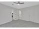 Spacious bedroom with gray carpet and access to other rooms at 1412 Tuxworth Cir, Decatur, GA 30033