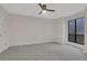 Bright bedroom with gray carpet and ceiling fan at 1412 Tuxworth Cir, Decatur, GA 30033