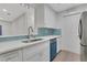 Modern kitchen with stainless steel appliances and teal blue accents at 1412 Tuxworth Cir, Decatur, GA 30033