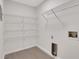 Laundry room with ample shelving and hookups at 1412 Tuxworth Cir, Decatur, GA 30033