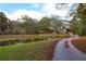 House nestled on a large lot with a pond and trees at 2812 Highway 16 E, Sharpsburg, GA 30277