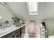 Bright bathroom with skylight and updated vanity at 2812 Highway 16 E, Sharpsburg, GA 30277