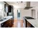 Galley kitchen with a white countertop and wood cabinets at 2812 Highway 16 E, Sharpsburg, GA 30277