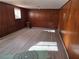 Finished basement room with wood paneling and laminate flooring at 2922 Eleanor Ter, Atlanta, GA 30318
