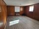 Spacious finished basement with wood paneling and laminate floors at 2922 Eleanor Ter, Atlanta, GA 30318