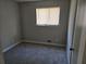 Simple bedroom with gray carpet and a window at 2922 Eleanor Ter, Atlanta, GA 30318