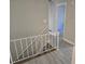 Upstairs hallway with light gray walls and wood-look flooring at 2922 Eleanor Ter, Atlanta, GA 30318